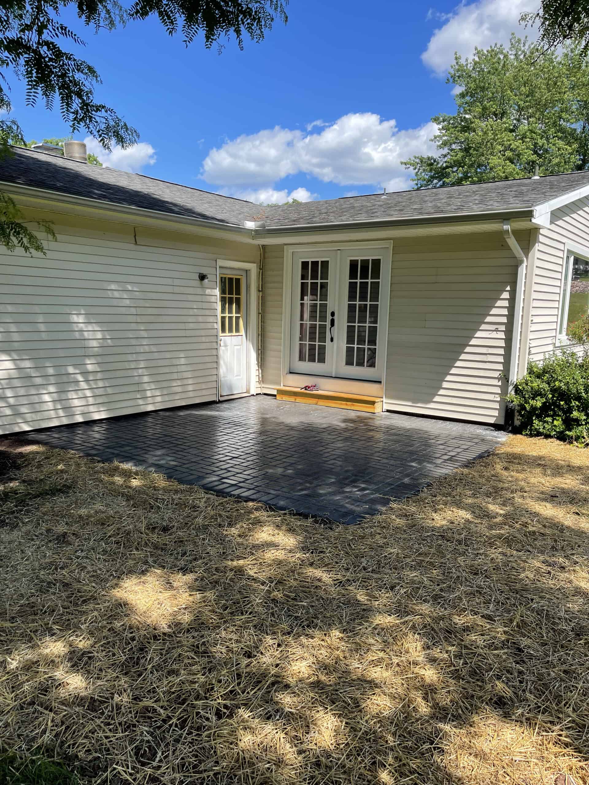 A small paver patio installed right out the back door of a happy client's home.
