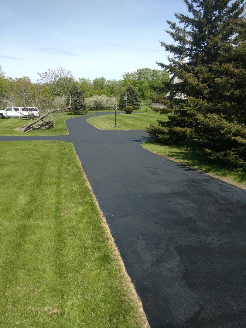 A brand new seal coated driveway.